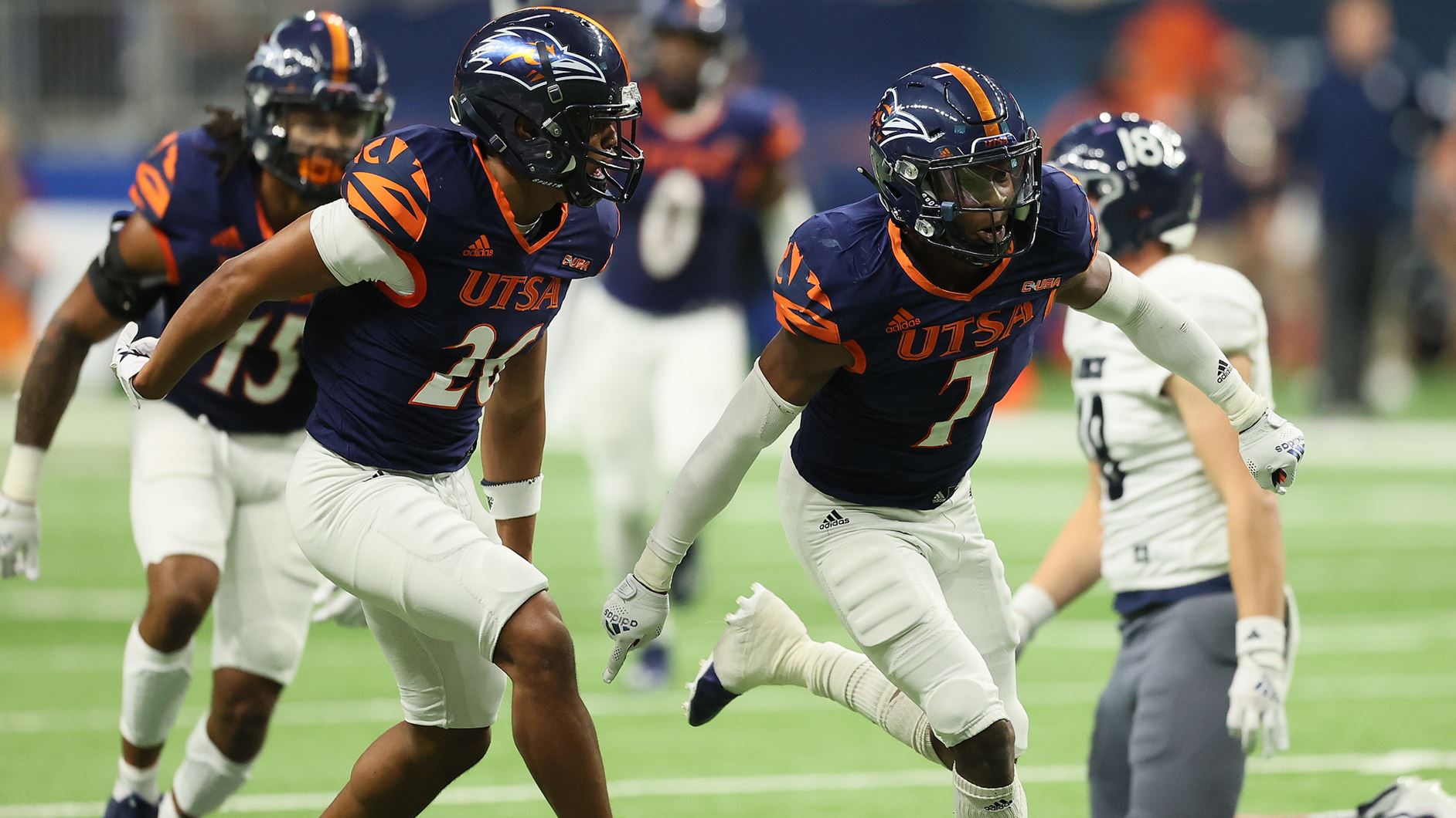UTSA football players on field